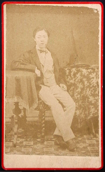  - Albumen photograph of a young Japanese woman dressed as a man.